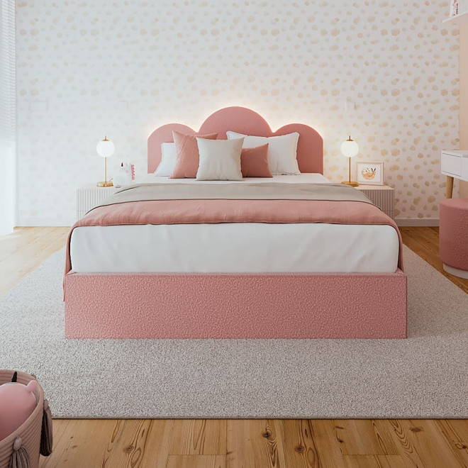 Cama tapizada rosa con cabecero nube
